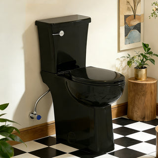 Black skirted toilet in a bathroom with checkered floor and plant decor